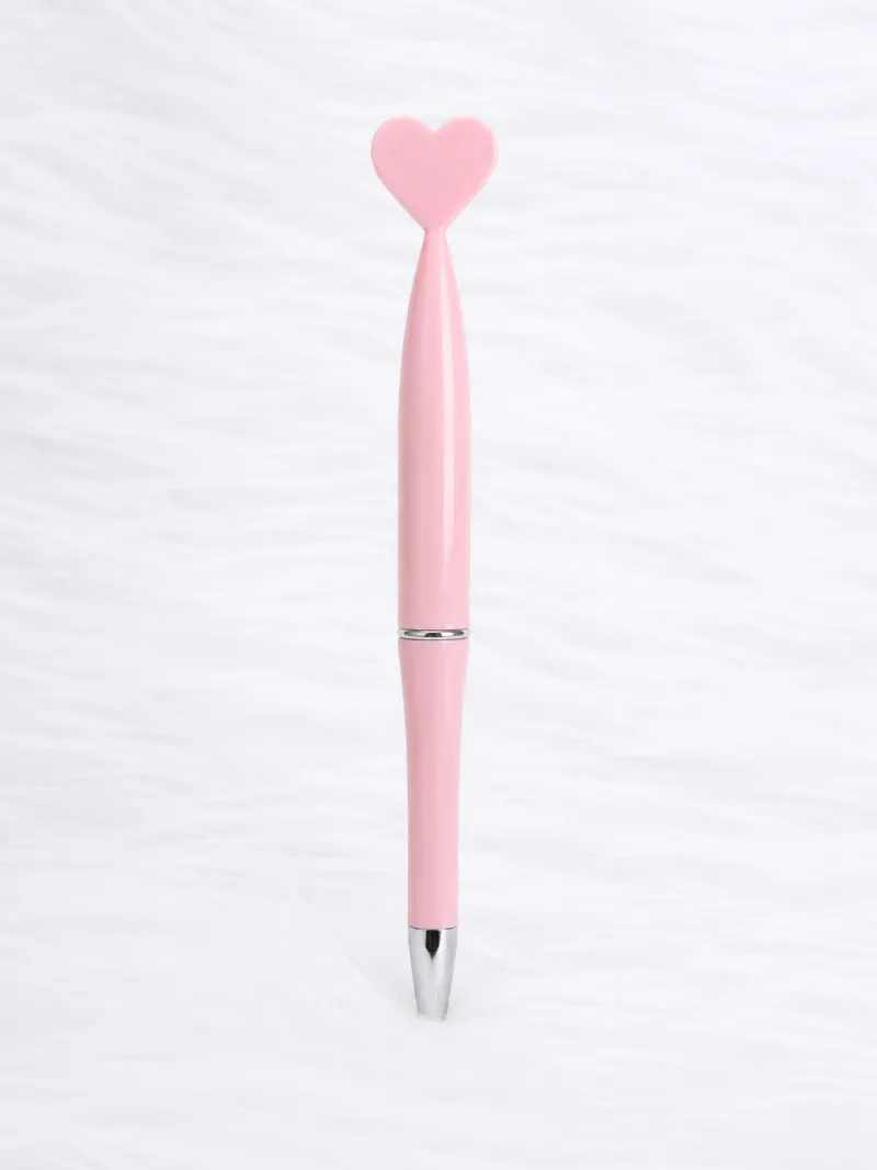 Caneta rosa com topo em forma de coração